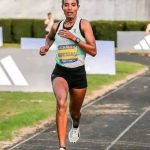 Tsige Gebreselma, an Ethiopian athlete, celebrates her victory at the Lisbon Half Marathon.