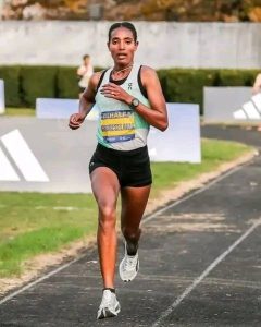 Tsige Gebreselma, an Ethiopian athlete, celebrates her victory at the Lisbon Half Marathon.